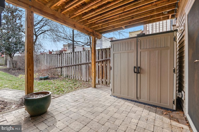 view of patio / terrace with a storage unit