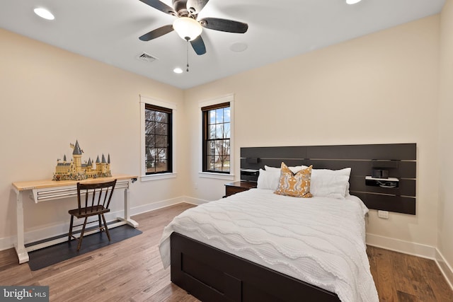 bedroom featuring hardwood / wood-style flooring and ceiling fan
