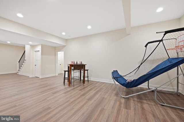 rec room with light hardwood / wood-style floors
