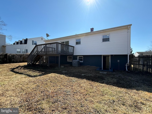 back of property with central air condition unit, stairway, fence, and a wooden deck