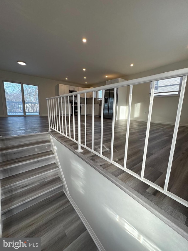 interior space featuring wood finished floors and recessed lighting