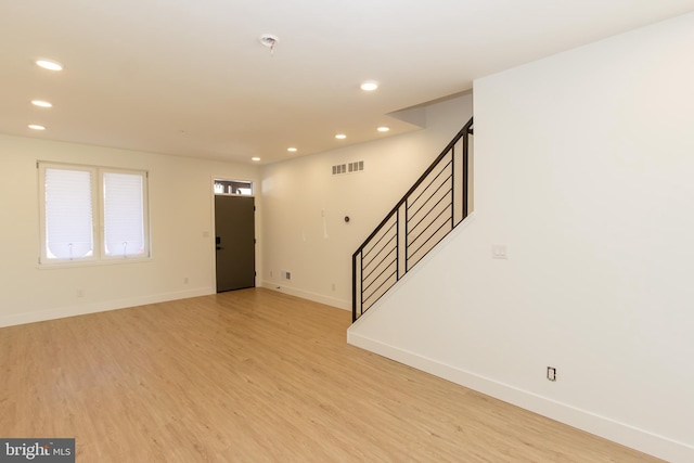 foyer with recessed lighting, visible vents, baseboards, stairs, and light wood-type flooring