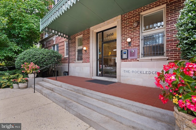 entrance to property with a porch