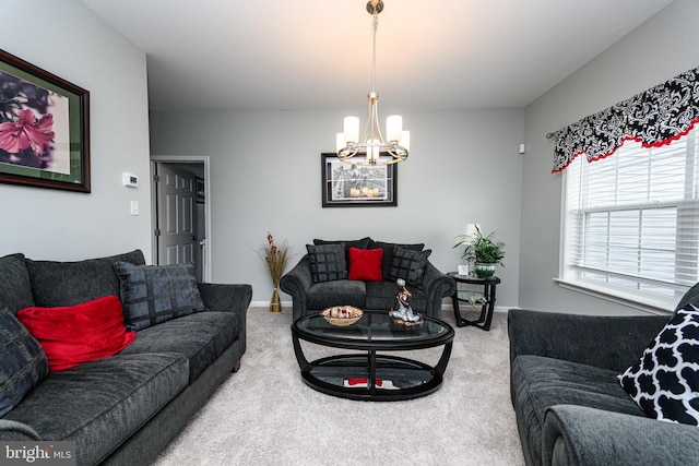 living room featuring carpet floors and a chandelier