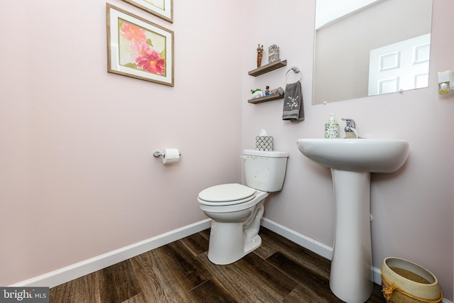 bathroom featuring toilet and hardwood / wood-style floors