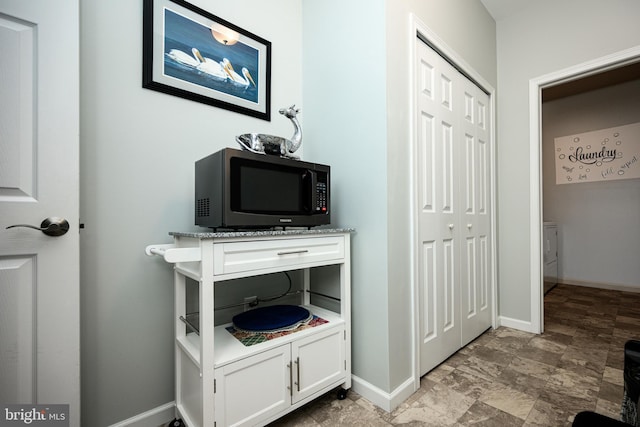 hallway with washer / clothes dryer