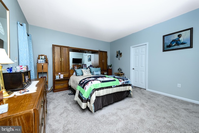 bedroom featuring light carpet