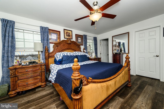 bedroom featuring ceiling fan and dark hardwood / wood-style flooring