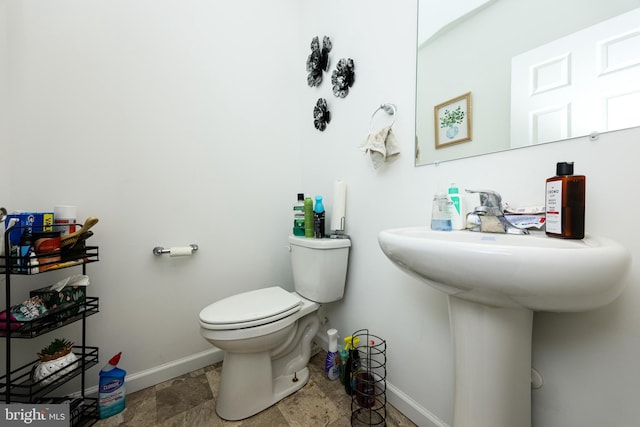 bathroom featuring toilet