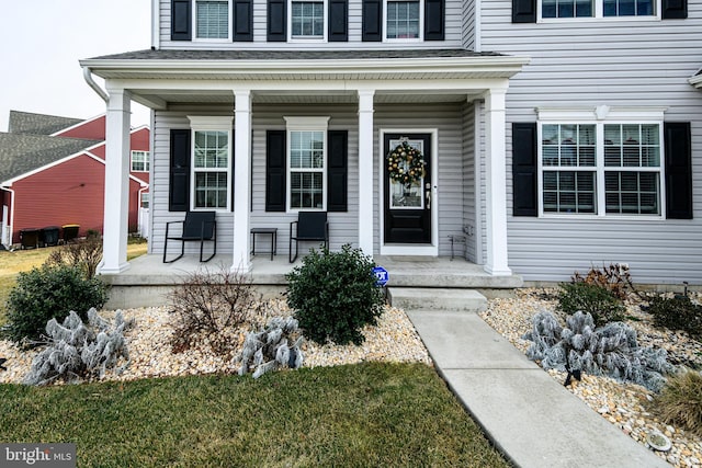 doorway to property featuring covered porch