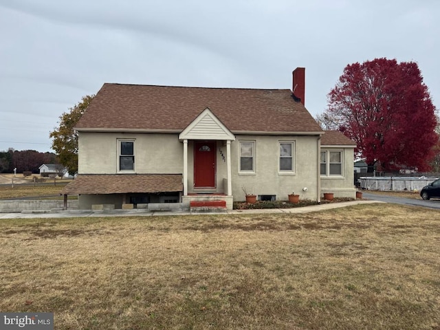 bungalow-style house with a front yard