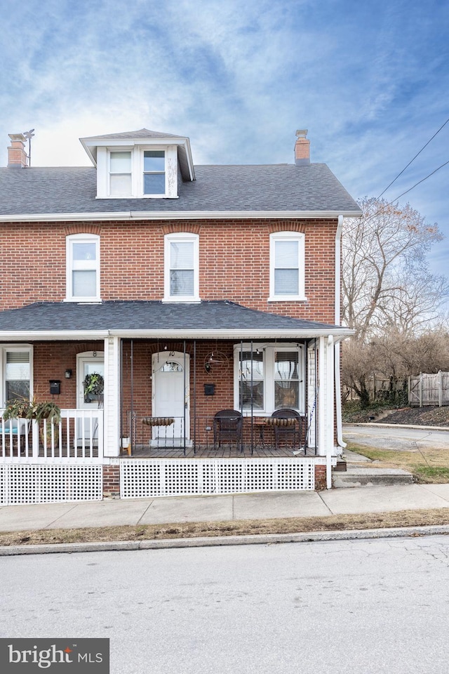 view of property featuring a porch