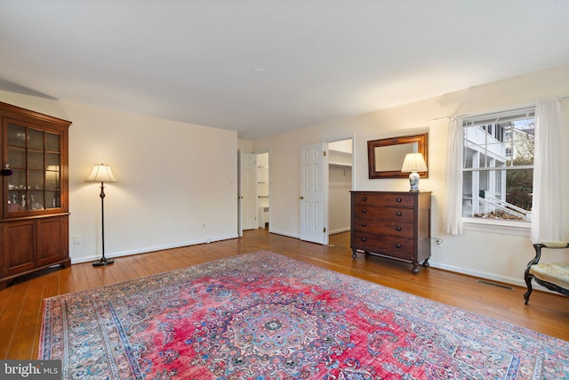 living area with hardwood / wood-style flooring