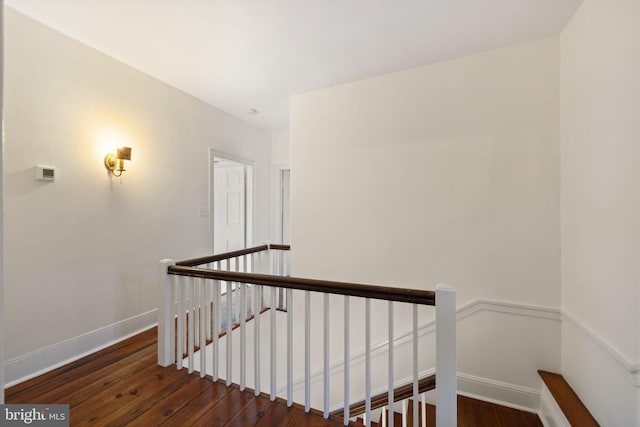 stairs with hardwood / wood-style flooring