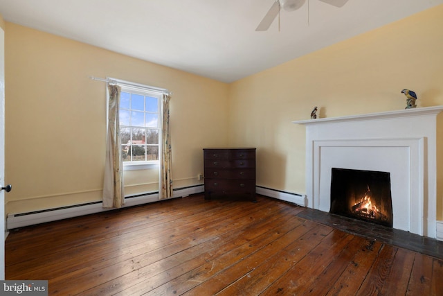 unfurnished living room with ceiling fan, dark hardwood / wood-style floors, and a baseboard heating unit