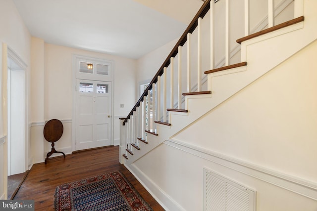 entryway featuring dark wood-type flooring