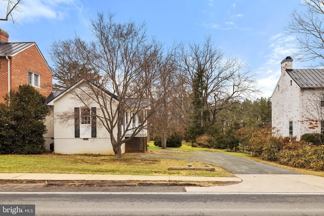 view of home's exterior with a yard