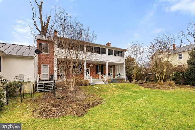 view of front of property with a porch and a front lawn