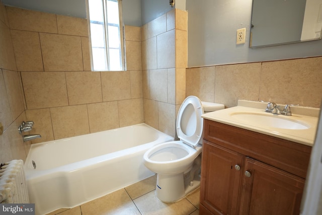 full bathroom with tile walls, radiator heating unit, vanity, tile patterned floors, and toilet