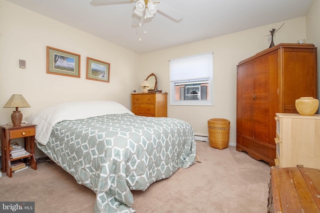 bedroom featuring ceiling fan, light colored carpet, and baseboard heating