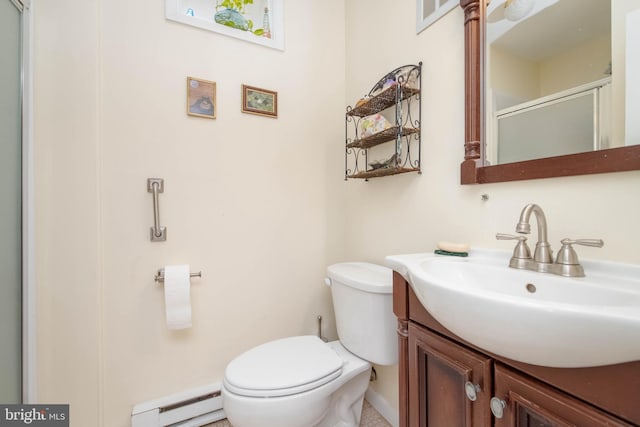 bathroom featuring vanity, an enclosed shower, baseboard heating, and toilet