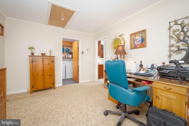 office space with washer / dryer, crown molding, and light colored carpet