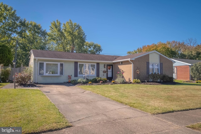 single story home featuring a front yard