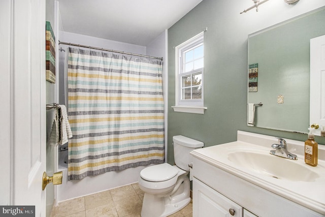 full bathroom with vanity, tile patterned floors, toilet, and shower / bath combo