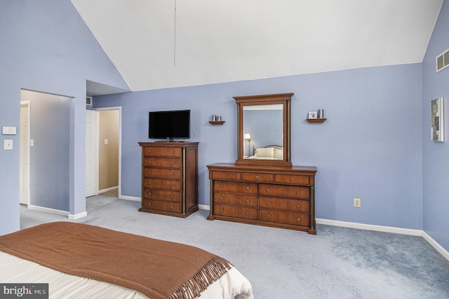 bedroom featuring lofted ceiling and light colored carpet