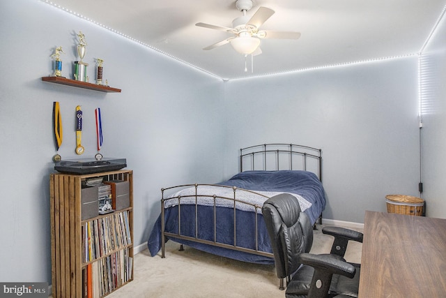 bedroom featuring light carpet and ceiling fan