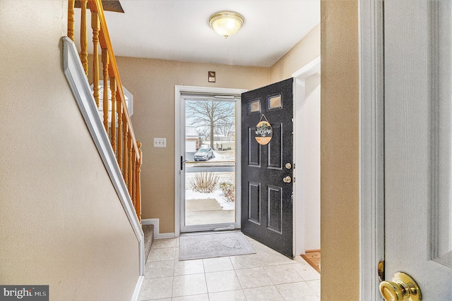 view of tiled foyer entrance