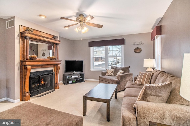 living room with light colored carpet and ceiling fan