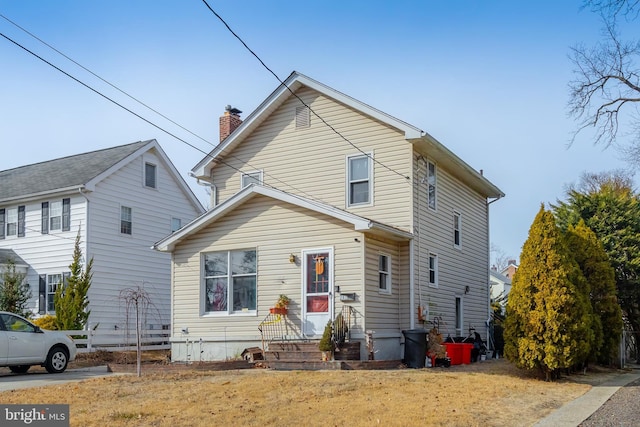 front facade with a front yard