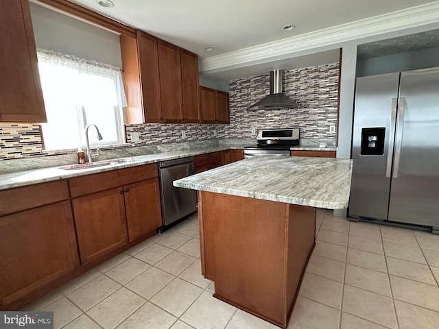 kitchen with light tile patterned floors, a sink, appliances with stainless steel finishes, backsplash, and wall chimney exhaust hood