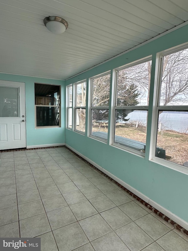 unfurnished sunroom featuring a healthy amount of sunlight