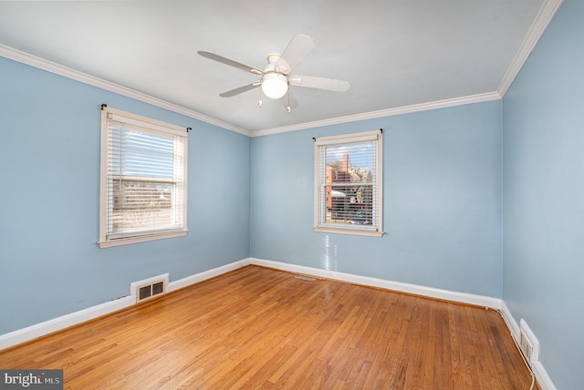 empty room featuring crown molding, ceiling fan, and light wood-type flooring