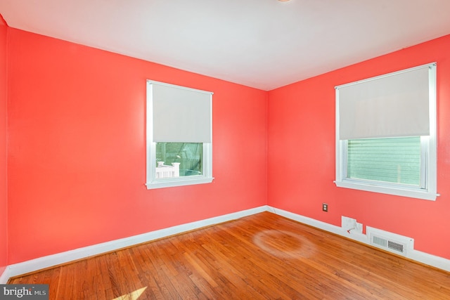 empty room featuring hardwood / wood-style floors