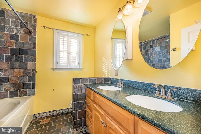 full bathroom with vanity, washtub / shower combination, and toilet