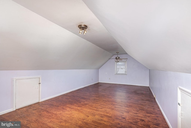 bonus room featuring dark hardwood / wood-style floors and vaulted ceiling