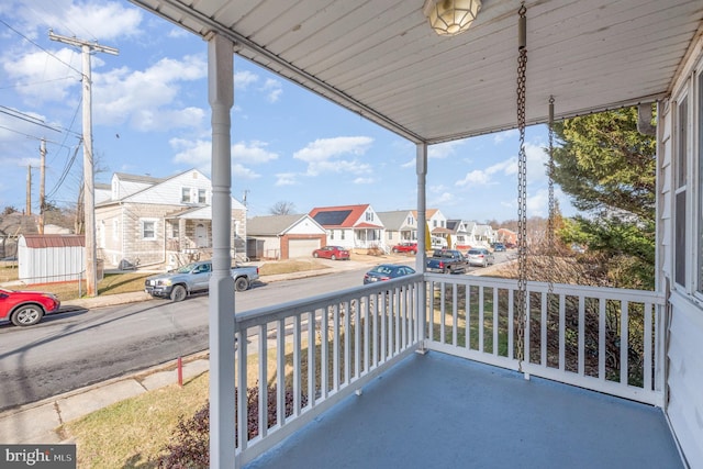 balcony featuring a porch and a residential view