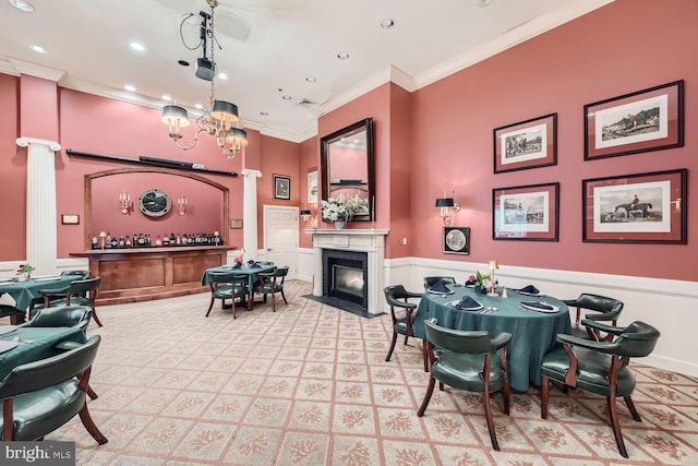 carpeted dining space featuring crown molding