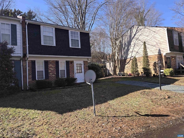 view of side of home featuring a lawn