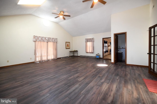 unfurnished living room with a healthy amount of sunlight, dark hardwood / wood-style floors, and high vaulted ceiling