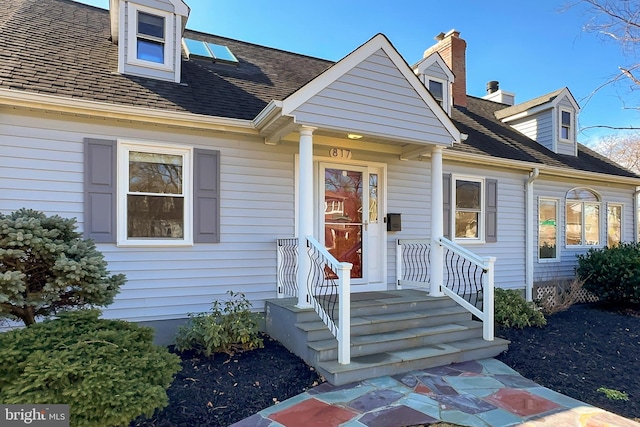 view of front of house with roof with shingles