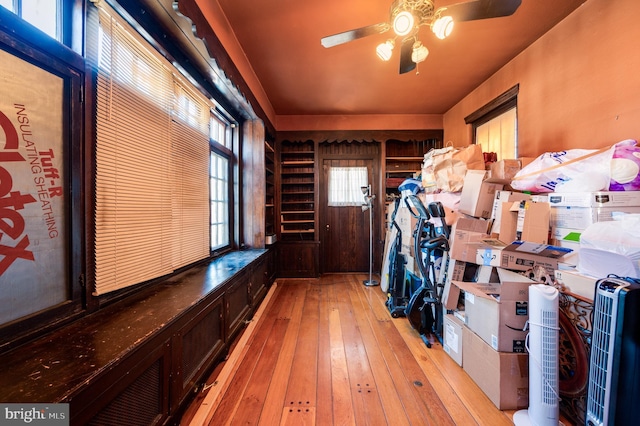 mudroom with ceiling fan and light wood finished floors