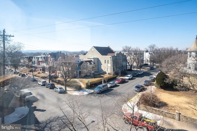 view of street with a residential view and sidewalks