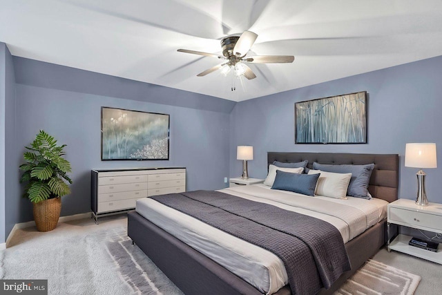 bedroom featuring ceiling fan, lofted ceiling, and carpet