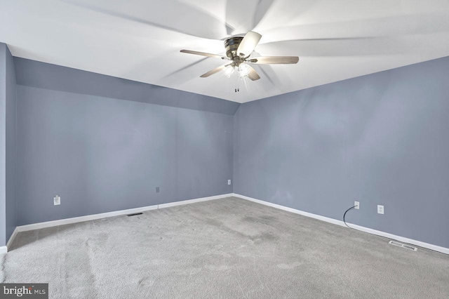 carpeted empty room with lofted ceiling and ceiling fan