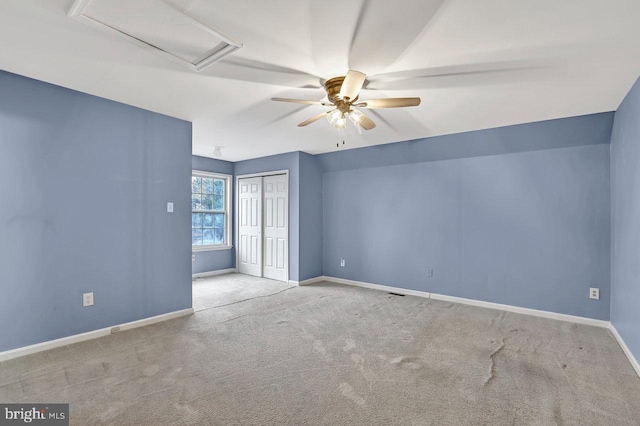 spare room with light carpet and ceiling fan