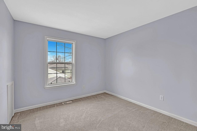 unfurnished room featuring carpet floors